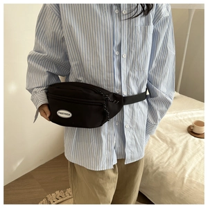 Close-up of black nylon waist bag with FANYISSA logo and sporty zipper pull cords