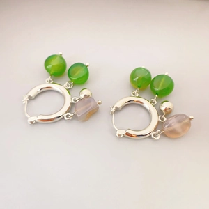 Silver hoop earrings with green agate beads and lavender stone pendants in modern style