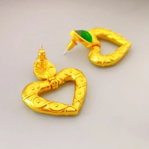 Vintage gold heart earrings with green gemstone in a classic French designer style