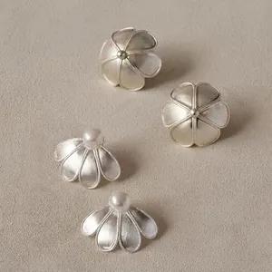 Silver brushed flower earrings and pearl fan studs set with intricate beaded edges