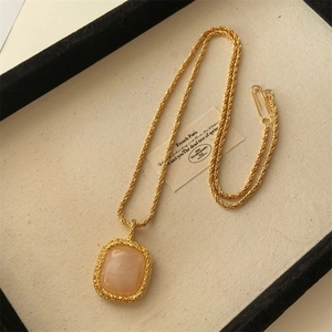 Vintage gold-plated rope chain necklace with a large rectangular champagne crystal pendant