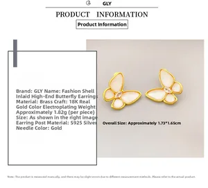 Close-up of butterfly stud earring featuring 18K gold plating and shell wing inlay