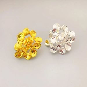 3D floral stud earrings in polished gold and silver plating with a minimalist design