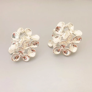 Elegant silver flower cluster earrings in polished metal with a 3D floral design