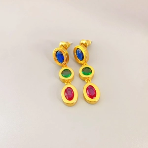 Elegant gold earrings with oval dark blue green and rose red gemstones in a vertical drop