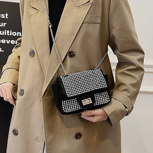 Sparkling rhinestone crossbody chain bag in black suede with silver metal lock detail