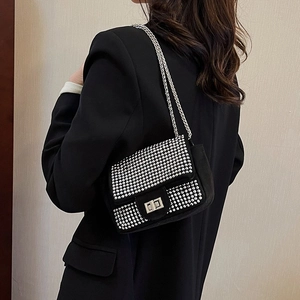 Chic black crossbody bag with shimmering silver rhinestones and elegant chain strap