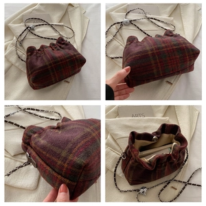 Detailed views of red plaid bucket bag featuring a drawstring closure and chain strap