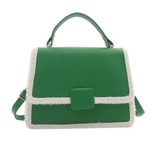 Green faux leather crossbody bag with white fleece trim and square buckle detail