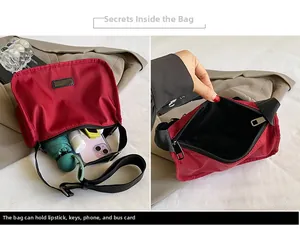 Detail showing the large capacity of the dark red nylon bag with daily essentials inside