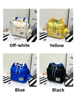 Canvas bucket bag detail showing drawstring closure and front pocket in four colors