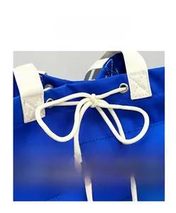 Close-up of durable navy nylon bag featuring white drawstring closure and reinforced handle