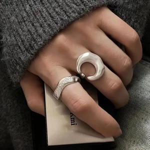 Minimalist silver moon ring set with freedom engraving and matte brushed texture