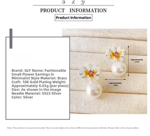 Detailed view of flower pearl earrings with silver needles and 18K gold plating