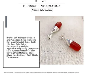 Detail view of red capsule earrings with S925 silver pins and 18K gold plating