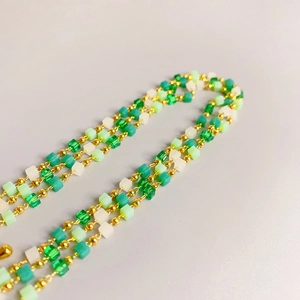 Three-layer green and white cube bead necklace with elegant gold spacers in a fresh style