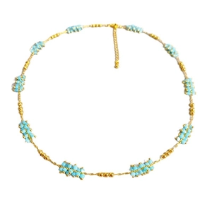 Minimalist beaded necklace with gold metal beads and small turquoise blue seed clusters