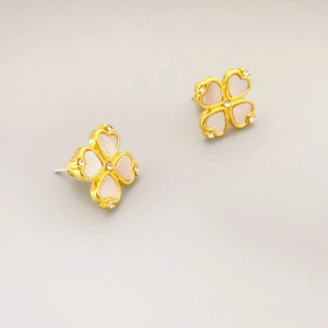 Elegant gold-plated heart clover earrings featuring shell inlay and sparkling crystals