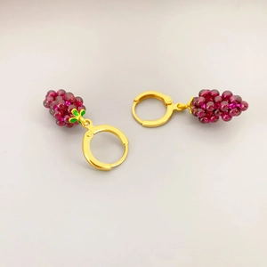 Pastoral style garnet grape earrings with gold-plated hoops and green enamel leaf detail