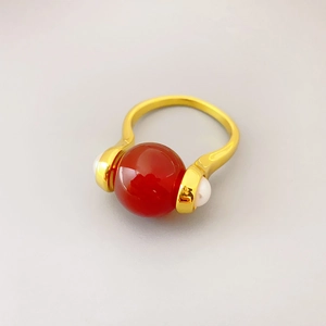 Rotating red agate ring with pearl accents in gold-plated copper finish for women