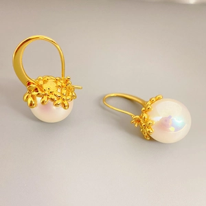 Elegant 18K gold-plated brass earrings with large white Mabe pearls and floral petal detail