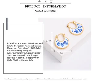 Detail view of U-shaped blue and white porcelain earrings with 18K gold-plated frames