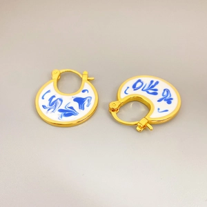 Blue and white porcelain enamel drop earrings with 18K gold-plated horseshoe pendants
