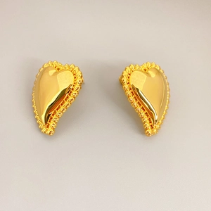 Elegant gold heart earrings with polished surface and vintage beaded border design