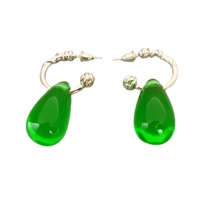 Elegant green teardrop pendant earrings with twisted gold-colored hoops on a white background