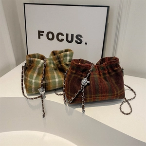 Plaid wool bucket bag with drawstring and chain strap in autumn check pattern
