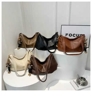 Large PU leather crescent tote bags in five colors with cute rabbit charms and focus on texture