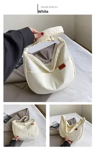 Detail view of white corduroy tote bag showing side pocket and brown SPORT leather patch