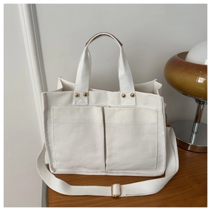 Sac fourre-tout en toile minimaliste avec deux poches avant et bandoulière réglable