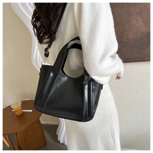 Classic black leather tote bag for women, versatile shoulder and crossbody carry style