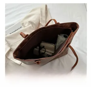 Spacious interior of brown vintage tote bag showing large capacity for daily essentials