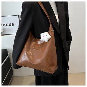 Brown large capacity hobo shoulder bag with plush star charm and vintage leather texture