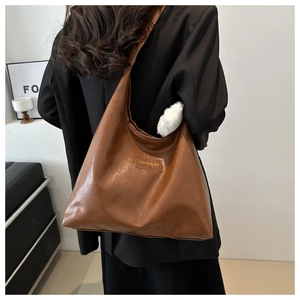 Brown large capacity PU leather tote bag with minimalist style shown on model