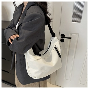 Minimalist white nylon crescent hobo bag with adjustable black wide strap for women