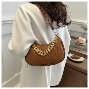 Brown quilted underarm bag with gold chain strap and elegant geometric stitching