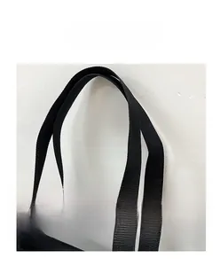Close-up of durable black nylon tote bag handles with high-quality woven texture detail