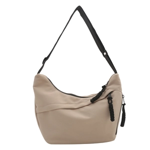 Minimalist beige nylon crescent tote bag with black adjustable strap and rope pullers