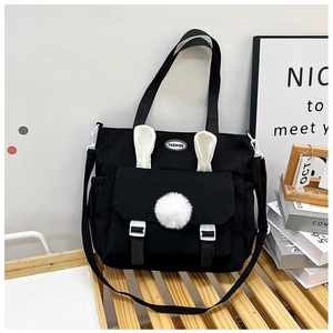 Cute black canvas tote bag with bunny ears and plush ball for students to carry books