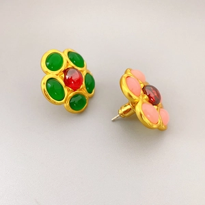 Vintage floral stud earrings with green and pink resin stones on golden metal base