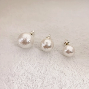 Minimalist round stud earrings with matte silver texture in three different sizes