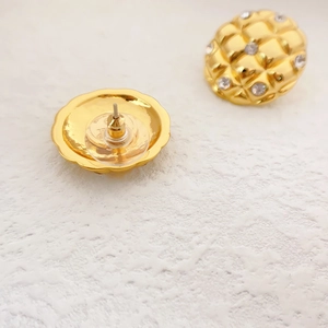 Golden pineapple design round earrings with quilted texture and sparkling rhinestones