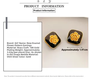 Detail of square black enamel stud earrings with golden camellia pattern and 925 silver needles