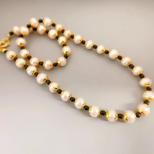 Elegant freshwater pearl choker necklace with gold flower spacers and black accent beads