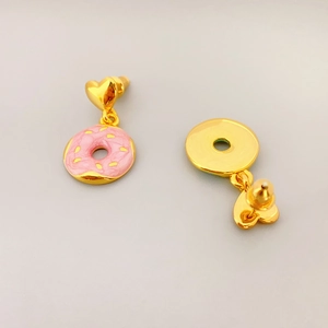 Pink enamel donut earrings with golden heart studs, showing front and back views of the pair