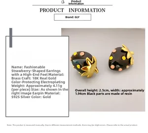 Detail view of strawberry earrings with dimensions 2.5cm by 1.94cm and 4.11g weight