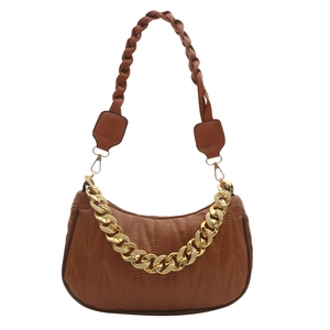 Caramel brown quilted leather baguette bag with woven strap and gold chain detail